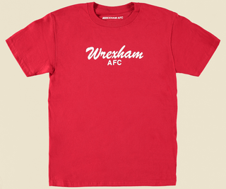 flat lay photo of a red youth tee with the words "wrexham afc" in white across the front